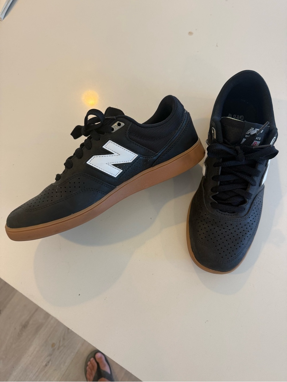 New Balance Men's Black Sneakers with White Logo and Gum Sole